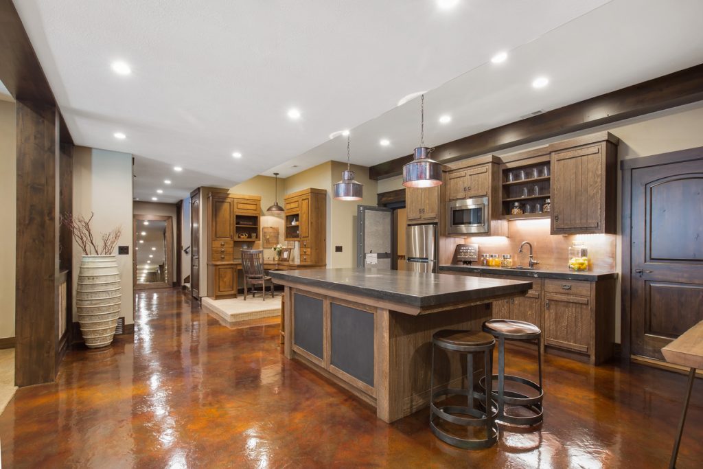 erracotta-themed kitchen with a stylish countertop table and wooden cabinets