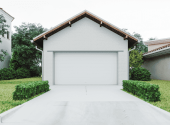 concrete driveway of a white-painted garage