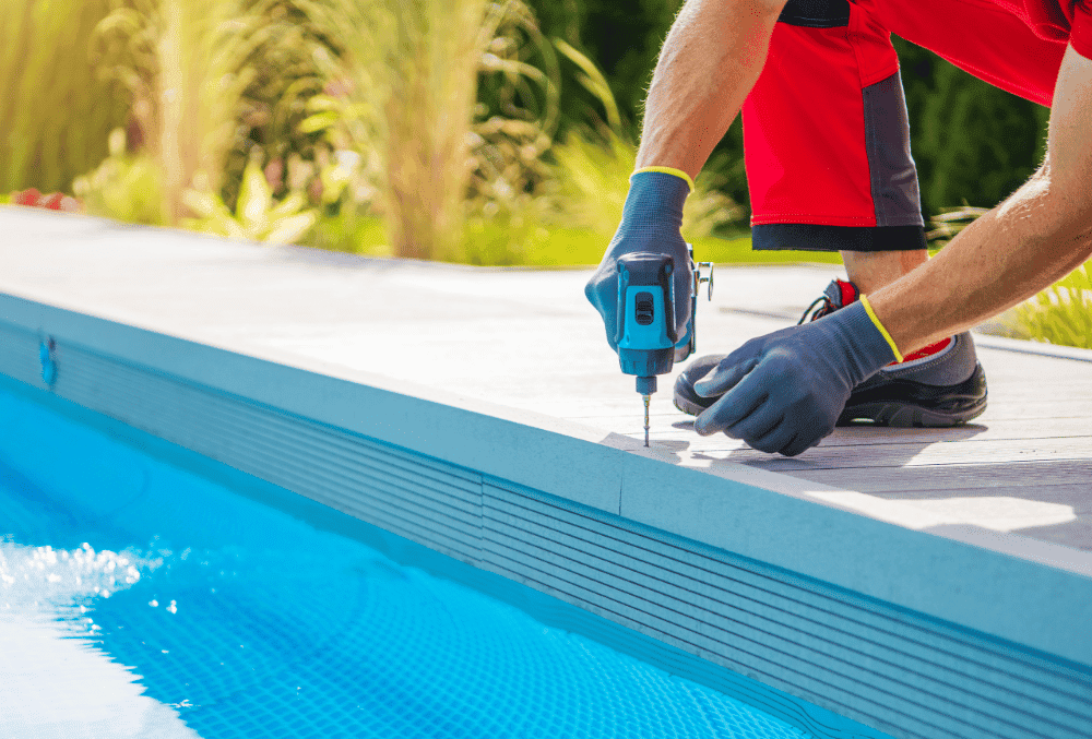 man fixing pool deck