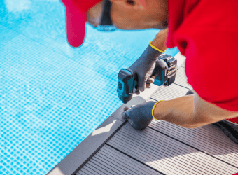 man fixing pool deck