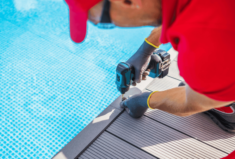 man fixing pool deck